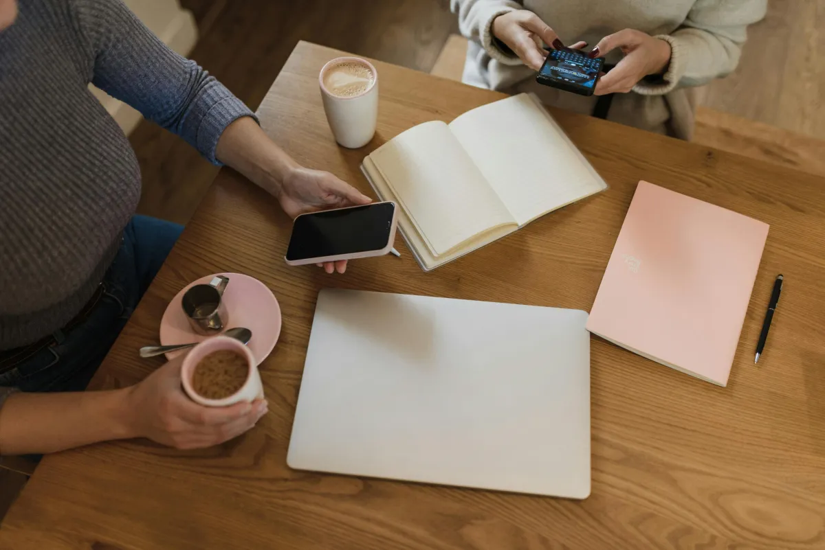 Two phones side by side showing a shared activity screen