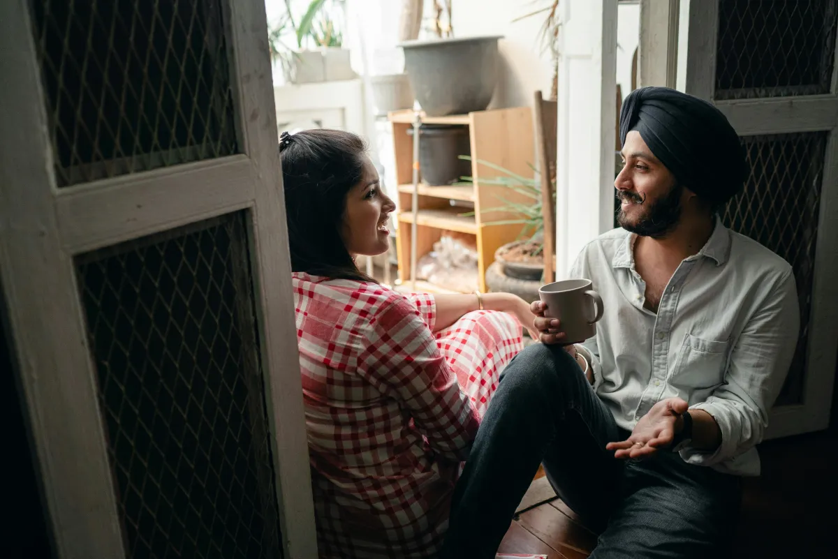 Couple having a meaningful conversation on a couch together