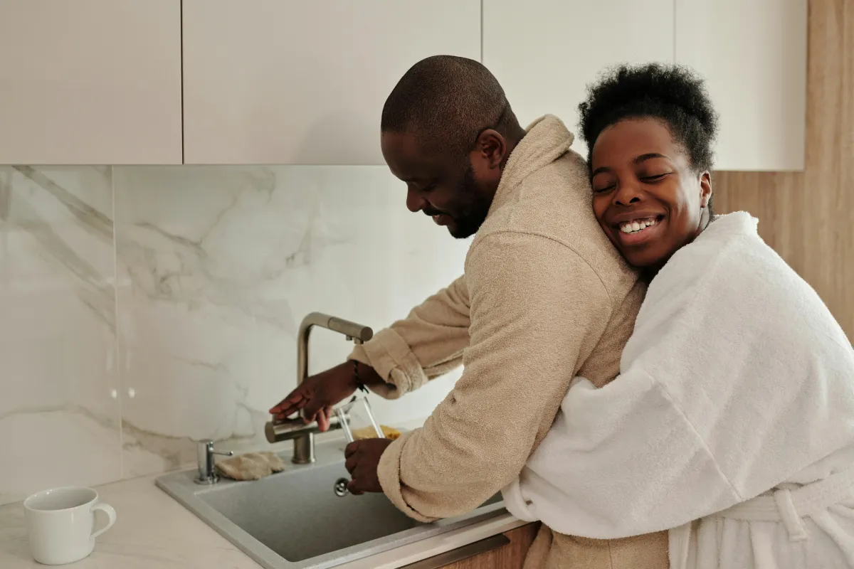 Couple sharing a moment together in the morning before work, couples daily ritual