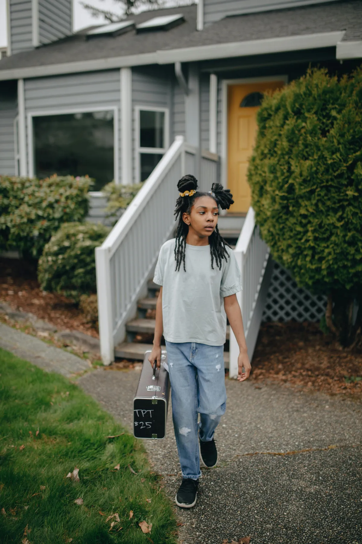 Young adult leaving home with suitcase, family connection after leaving home